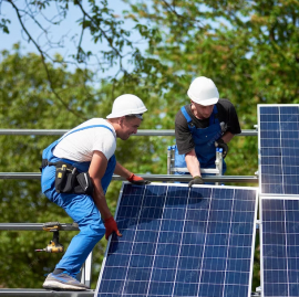 Solar panel installation with a blue sky background, highlighting completed work